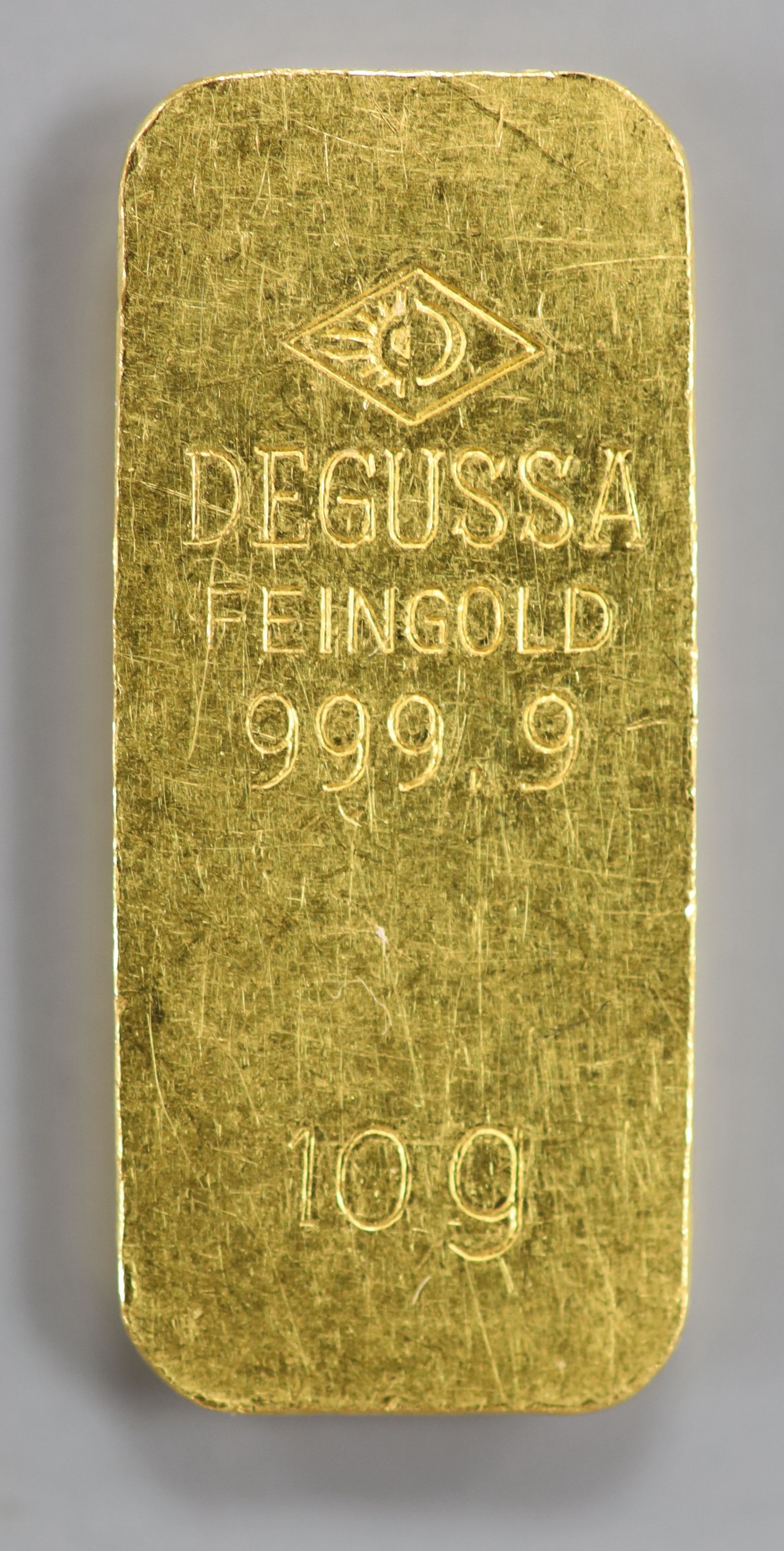 A Degussa 999.9 yellow metal 10 gram ingot.